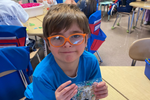  student holding handmade gift bag